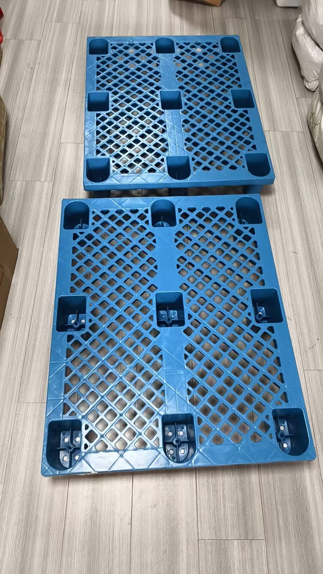 Plastic pallets used to keep goods off the floor